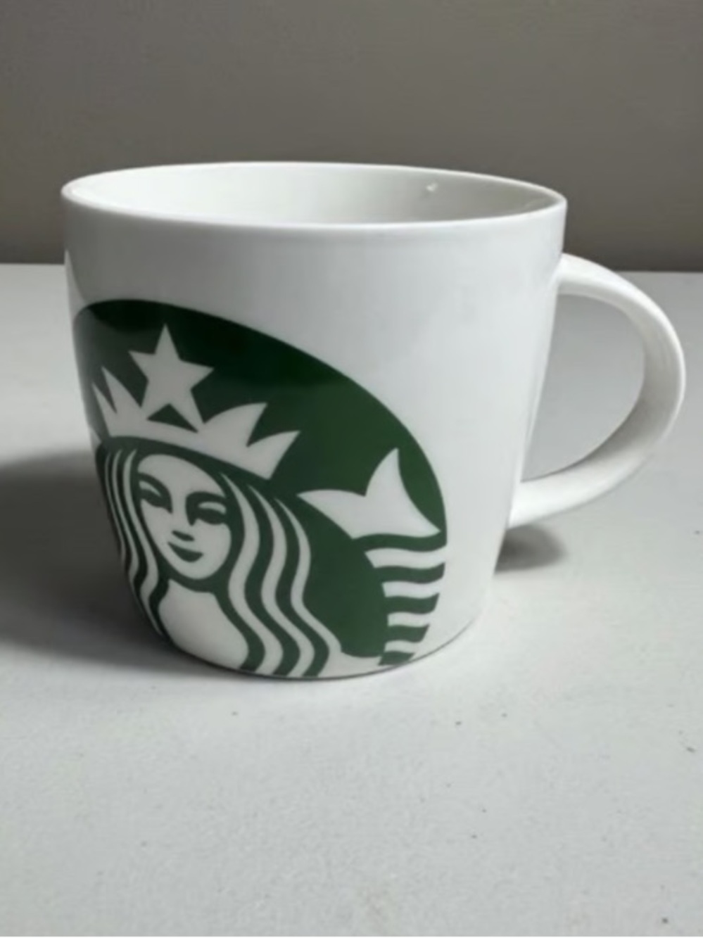 White Ceramic Coffee Mug with Green Logo